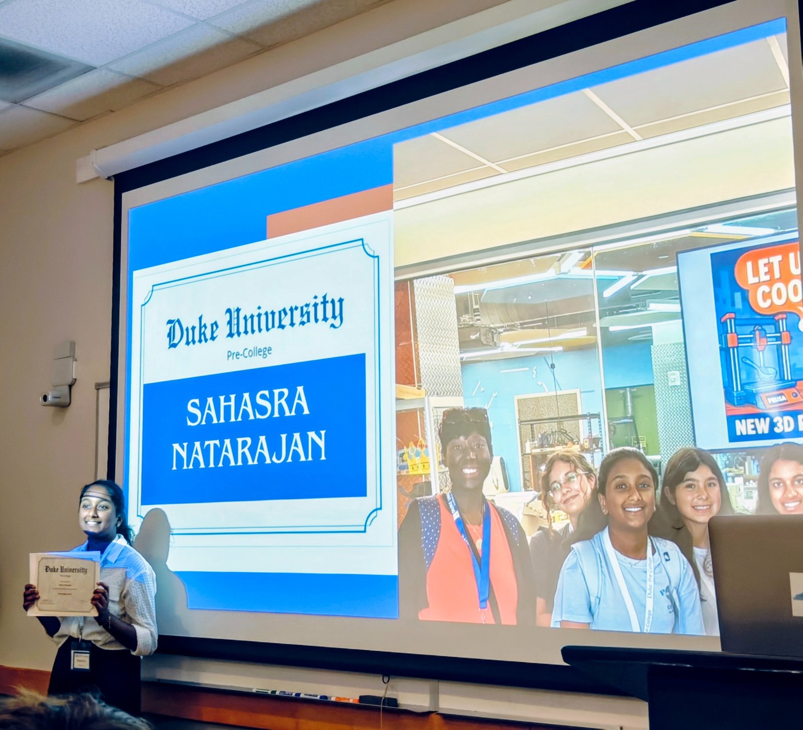 Sahasra receiving a Duke University Pre-College certificate